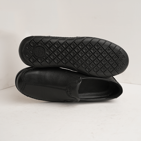 Austria Pebble-Grain Slip-On in Black — rubber sole